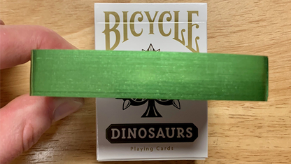 Juego de cartas de dinosaurio de bicicleta dorada